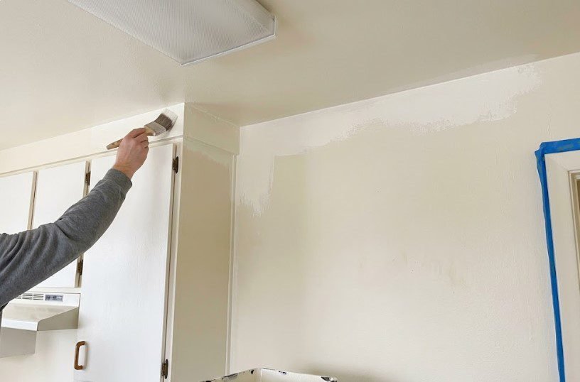t coat of paint applied after walls were washed